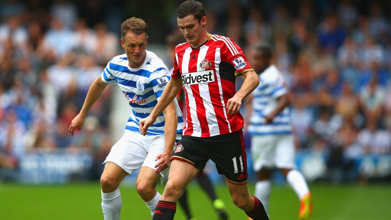 LONDON, ENGLAND - AUGUST 30:  Clint Hill of QPR and Adam Johnson of Sunderland compete for the ball during the Barclays Premier League match between Queens