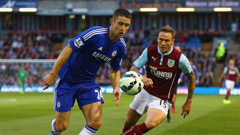 BURNLEY, ENGLAND - AUGUST 18:  Gary Cahill of Chelsea is closed down by Matthew Taylor of Burnley during the Barclays Premier League match between Burnley 