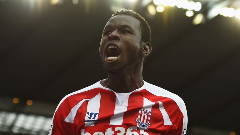 MANCHESTER, ENGLAND - AUGUST 30:  Mame Biram Diouf (L) of Stoke City celebrates scoring the opening goal during the Barclays Premier League match between M