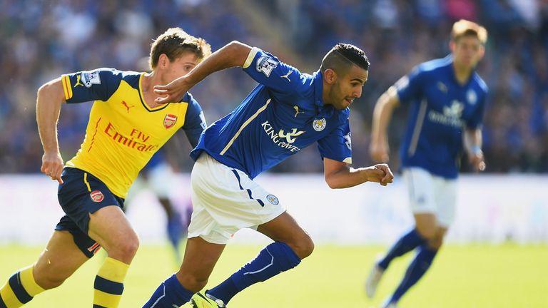 Riyad Mahrez of Leicester City is closed down by Nacho Monreal of Arsenal during the Barclays Premier League match between 