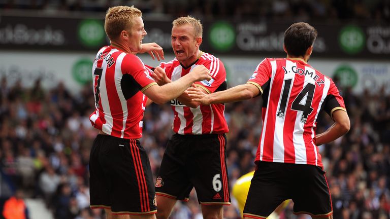 WEST BROMWICH, ENGLAND - AUGUST 16:  Sunderland player Lee Cattermole (c) congratulates Seb Larsson (l) after Larsson had score the second goal during the 