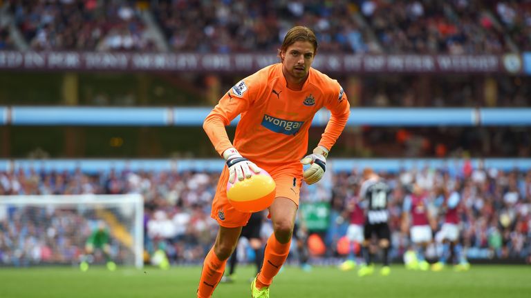 BIRMINGHAM, ENGLAND - AUGUST 23: Tim Krul of Newcastle United removes a beach ball from the pitch during the Barclays Premier League match between Aston Vi