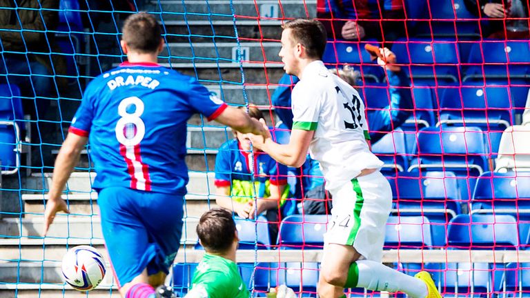 Inverness Caley score as the ball rebounds off young Celtic defender Eoghan O'Connell (r).