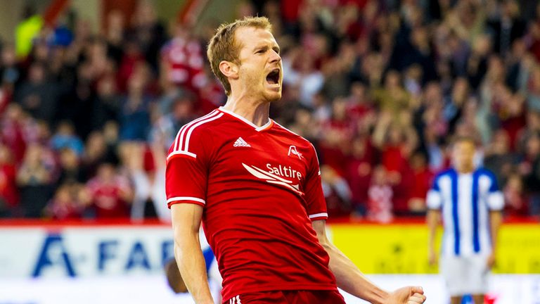 Aberdeen's Mark Reynolds roars with delight after scoring his side's second goal of the game v Real Sociedad in the Europa League