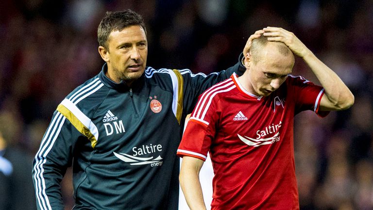 Aberdeen manager Derek McInnes (left) consoles Willo Flood at full-time of Europa League clash with Real Sociedad
