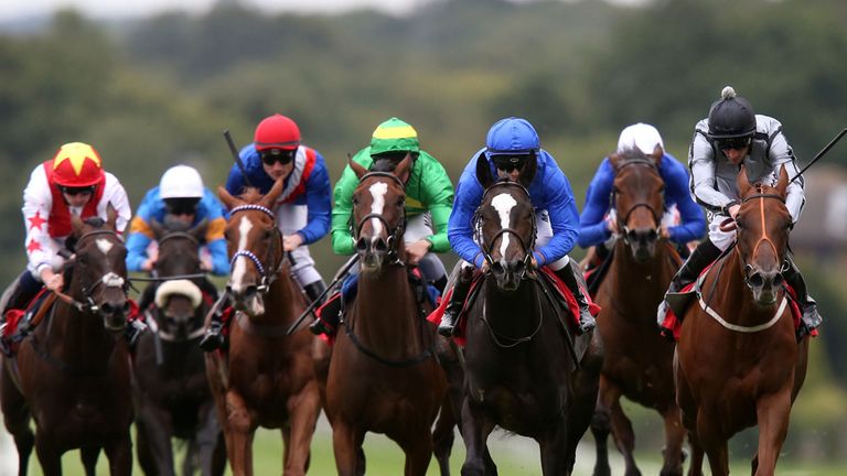 Finitry (blue cap) on the way to winning The Thoroughbred Breeders' Association Atalanta Stakes