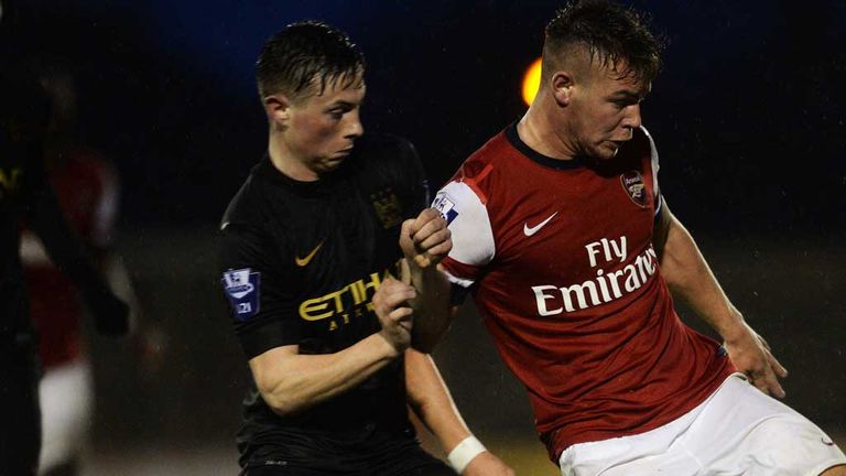 BOREHAMWOOD, ENGLAND - APRIL 07:  Jack Jebb of Arsenal is challenged by Adam Drury of Man City during the match between Arsenal and Manchester City in the 