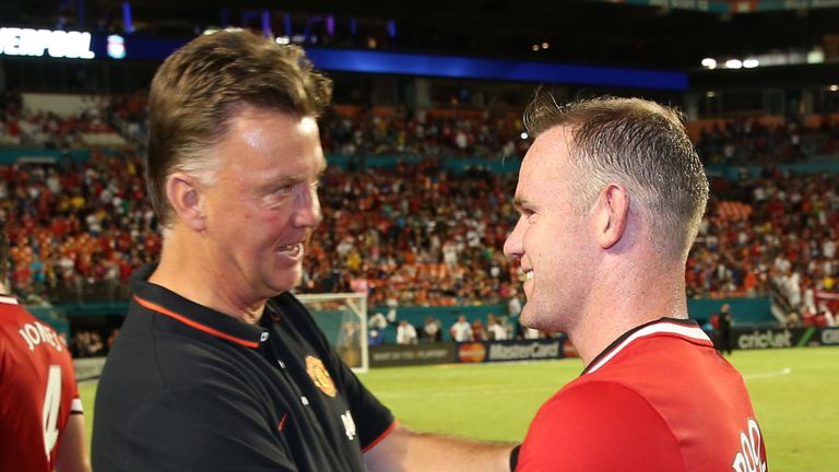 Manager Louis van Gaal of Manchester United congratulates Wayne Rooney
