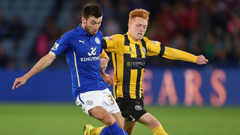 Michael Cain of leicester in action with Ryan Woods of Shrewsbury during the Capital One Cup second round match between Lei