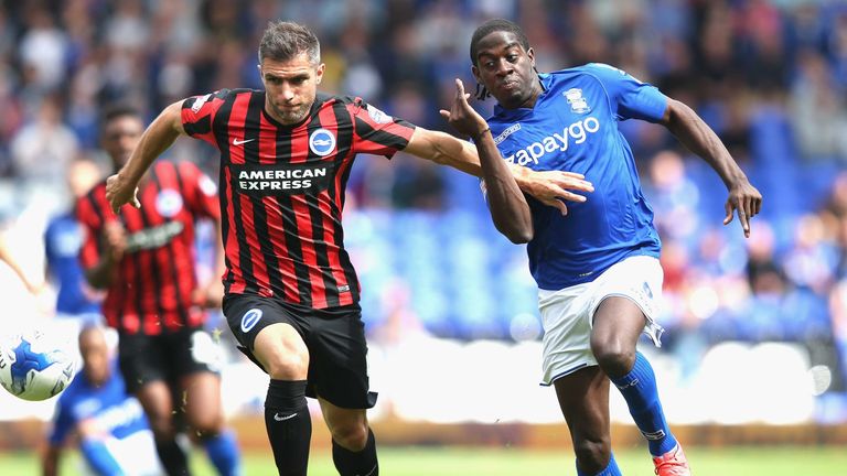 BIRMINGHAM, ENGLAND - AUGUST 16:  Clayton Donaldson of Birmingham City tangles with Aaron Hughes of  Brighton & Hove Albion during the Sky Bet Championship