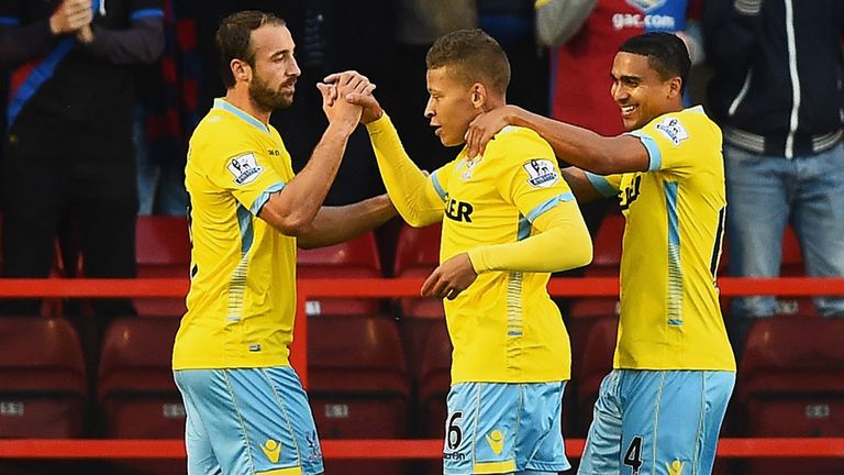 Dwight Gayle (C) of Crystal Palace celebrates scoring the opening goal with team mates during the Capital One Cup Second Roun