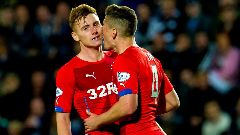 Lewis MacLeod is congratulated from team-mate Fraser Aird (right) after his shot deflected off a Falkirk defender to give his side the lead.