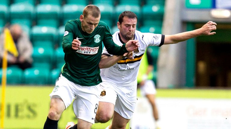 .Scott Robertson (left) and Dumbarton's Garry Fleming batte for possession.