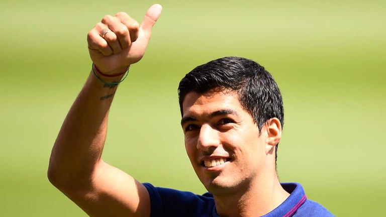 BARCELONA, SPAIN - AUGUST 19:  Luis Suarez of FC Barcelona gives his thumbs up during his presentation as new FC Barcelona player at Camp Nou on August 19,