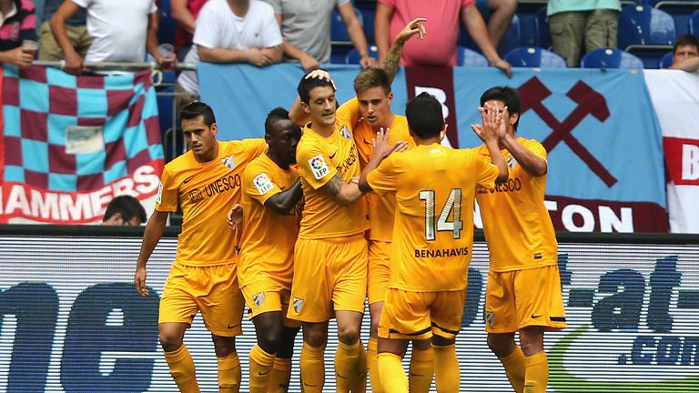 Malaga celebrate after scoring against West Ham in the Schalke Cup