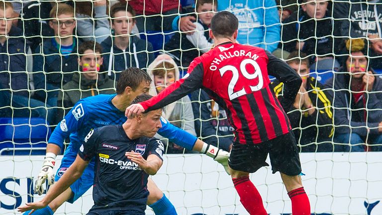 Michael O'Halloran (centre) slots home for St Johnstone to open the scoring
