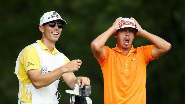 LOUISVILLE, KY - AUGUST 10:  Rickie Fowler (R) of the United States reacts on the fifth tee as caddie Joseph Skovron (L) looks on during the final round of