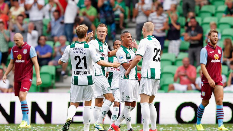 Tjaronn Chery (C) of Groningen is congratulated by team mates after scoring the first goal of the game during the pre-season clash against Aston Villa