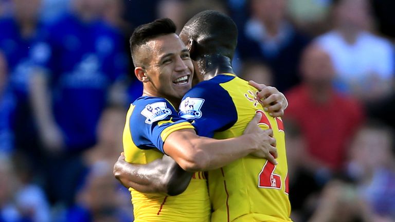 Arsenal's Alexis Sanchez (left) celebrates scoring his side's first goal of the game with teammate Arsenal's Yaya Sanogo during the Barclays Premier League