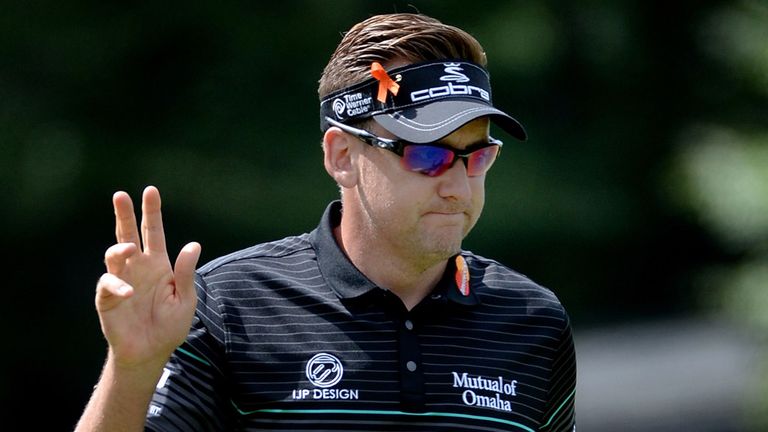 Ian Poulter of England waves to the crowd after making birdie on the 18th hole during the first round of the Deutsche Bank Championship.