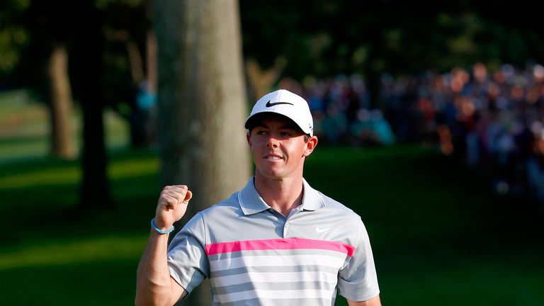 AKRON, OH - AUGUST 03:  Rory McIlroy of Northern Ireland celebrates after his winning putt on the 18th green during the final round of the World Golf Champ