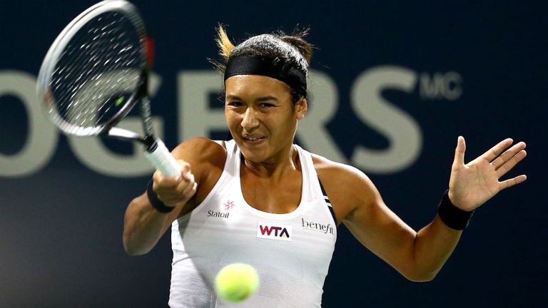 Heather Watson of Great Britain returns a shot to Victoria Azarenka of Belarus during the Rogers Cup in Montreal, Canada