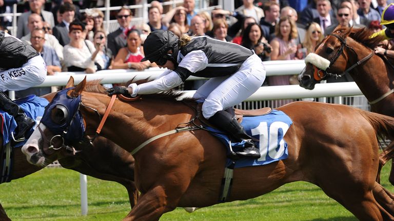Blaine ridden by Amy Ryan (right) comes through to win the Symphony Group Stakes during Day One of the 2014 Welcome To Yorkshire Ebor Festival at York Race