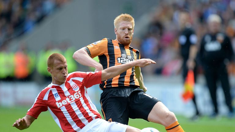 Paul McShane battles for the ball with Steve Sidwell