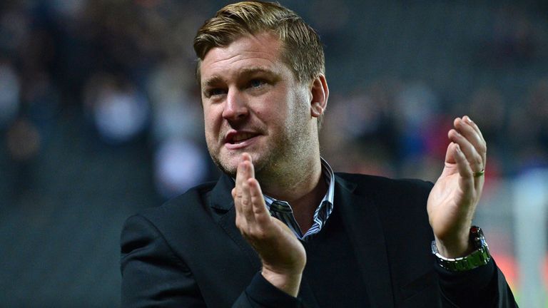 MK Dons English manager Karl Robinson applauds after the English League Cup second round football match between Milton Keynes Dons and Manchester United