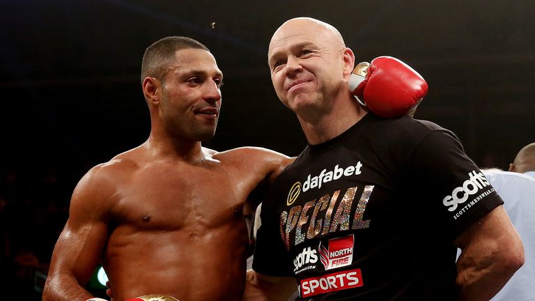 Kell Brook celebrates his victory over Vyacheslav Senchenko with trainer Dominic Ingle