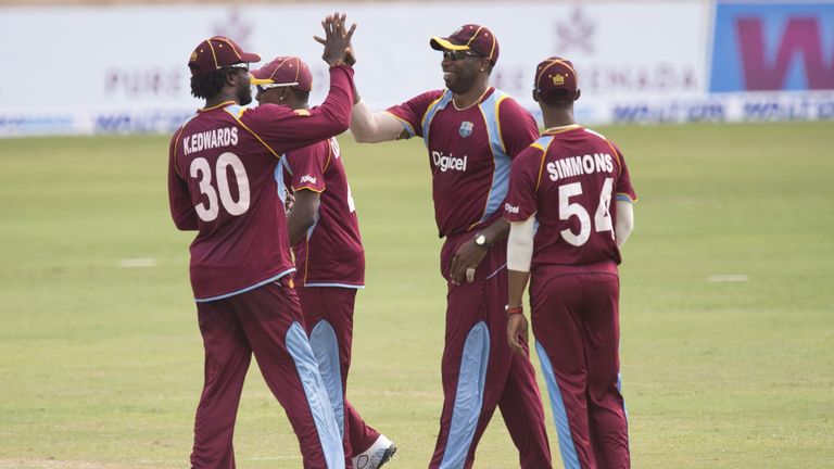Kieron Pollard (centre, right) is congratulated by team-mates after taking a catch. West Indies v Bangladesh, 2nd ODI, Grenada. Aug 22 2014.