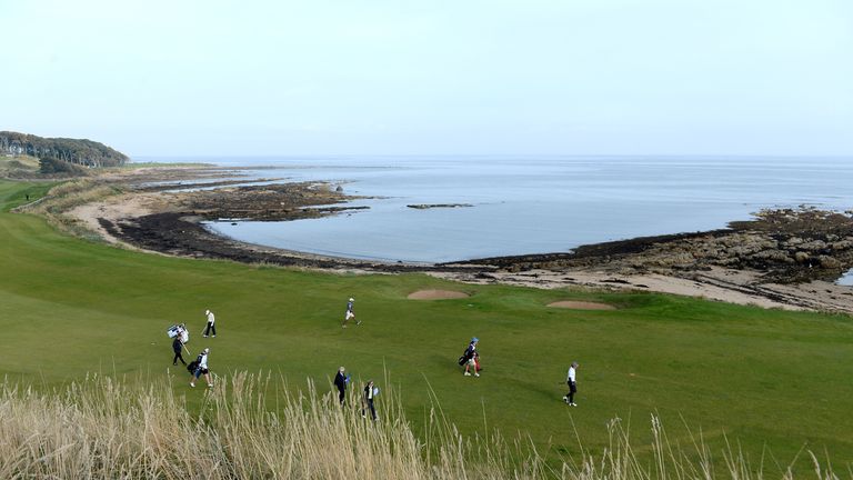 Players walk to the 12th green at Kingsbarns Golf Links