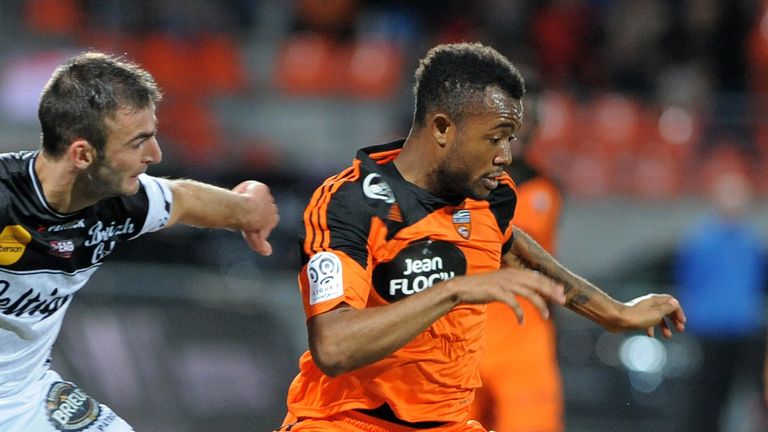 Lorient's forward Jordan Ayew (R) vies with Guingamp's French defender Reynald Lemaitre (L)