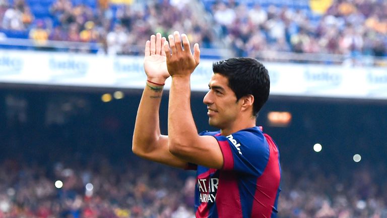Luis Suarez of Barcelona acknowledges the fans during the official presentation team prior to the game with Club Leon