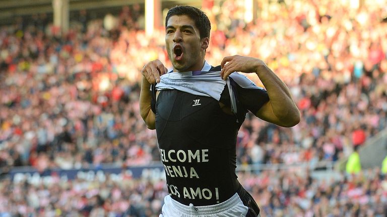 Liverpool's Uruguayan striker Luis Suarez lifts his jersey to reveal the message