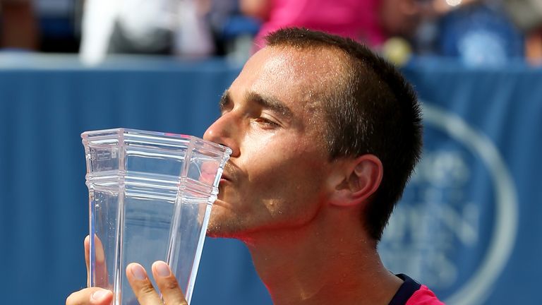 Lukas Rosol of the Czech Republic celebrates with the trophy after defeating Jerzy Janowicz of Poland during the men's final