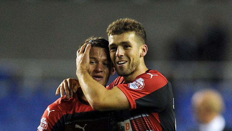 Huddersfield Town's Tommy Smith (right) and Jonathan Hogg celebrate their side's win after the Sky Bet Championship match at the Madejski Stadium.
