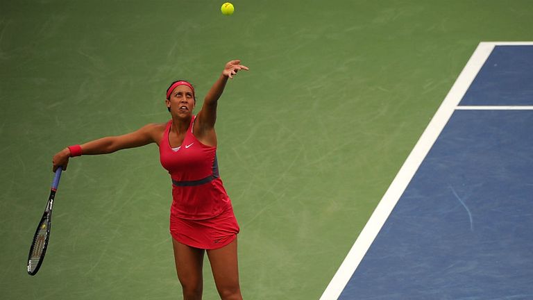 Madison Keys serves against Maria Sharapova of Russia at the Western & Southern Open 2014