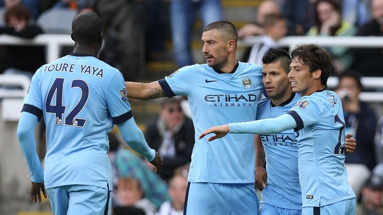 Manchester City's Spanish midfielder David Silva (R) celebrates with Manchester City Argentinian striker Sergio Aguero (2nd R) and Manchester City's Serbia