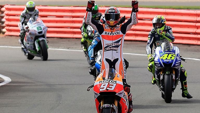 Marc Marquez celebrates his victory at Silverstone, his 11th in 12 races this season