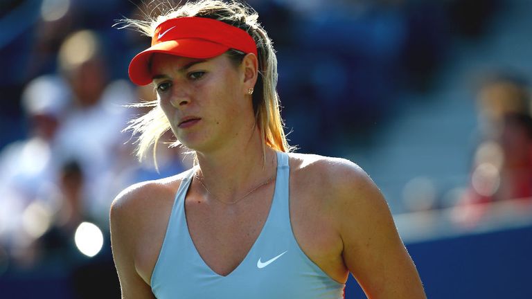 Maria Sharapova looks on against Alexandra Dulgheru during their US Open women's singles second round 2014