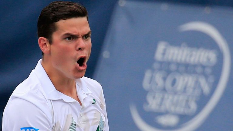 Milos Raonic of Canada celebrates a point against Steve Johnson of the United States during the Citi Open 2014