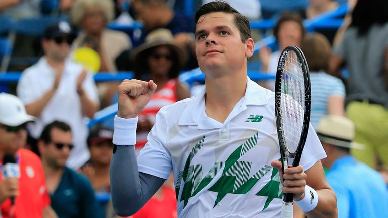 Milos Raonic of Canada celebrates after defeating Donald Young of the United States during their semi-final match during the Citi Open