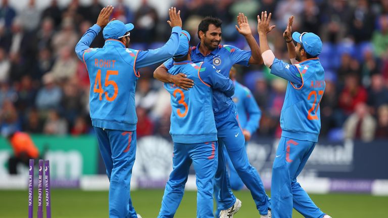 Mohammed Shami of India celebrates with Suresh Raina and Ajinkya Rahane after capturing a wicket in the second one-dayer against England in Cardiff