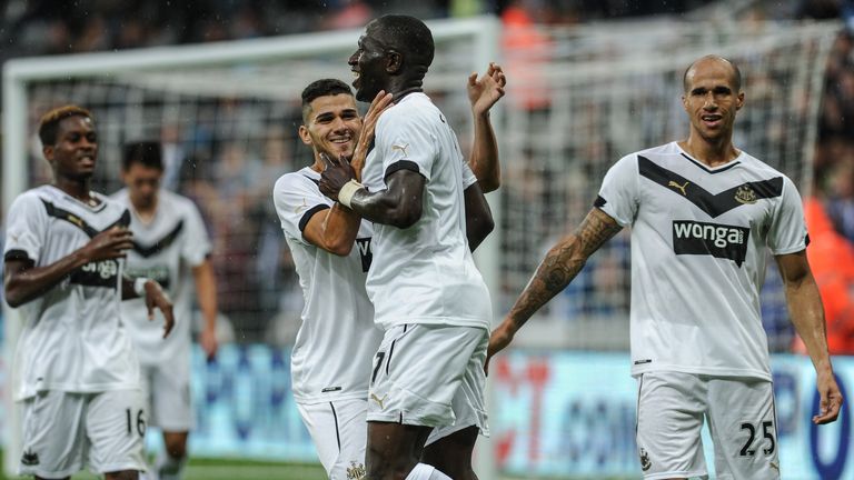 Moussa Sissoko (C) of Newcastle celebrates with teammates Rolando Aarons (Far left), Mehdi Abeid (L) and Gabriel Obertan