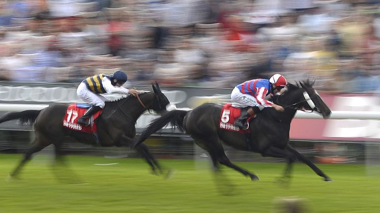 YORK, ENGLAND - AUGUST 23:  Louis Steward riding Mutual Regard (R) win The Betfred Ebor at York racecourse on August 23, 2014 in York, England. (Photo by A