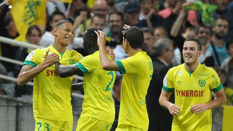 Nantes' French forward Yacine Bammou (L) celebrates with his teammates after scoring during the French L1 football match Nantes (FCNA) vs Lens