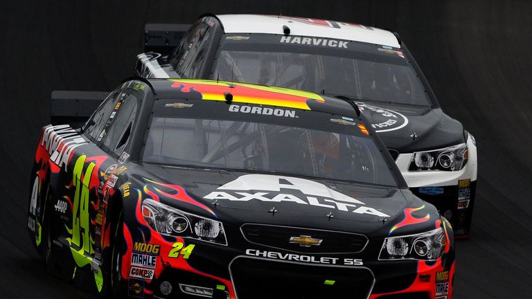  Jeff Gordon, driver of the #24 Axalta Chevrolet, leads Kevin Harvick, driver of the #4 Jimmy John's Chevrolet,