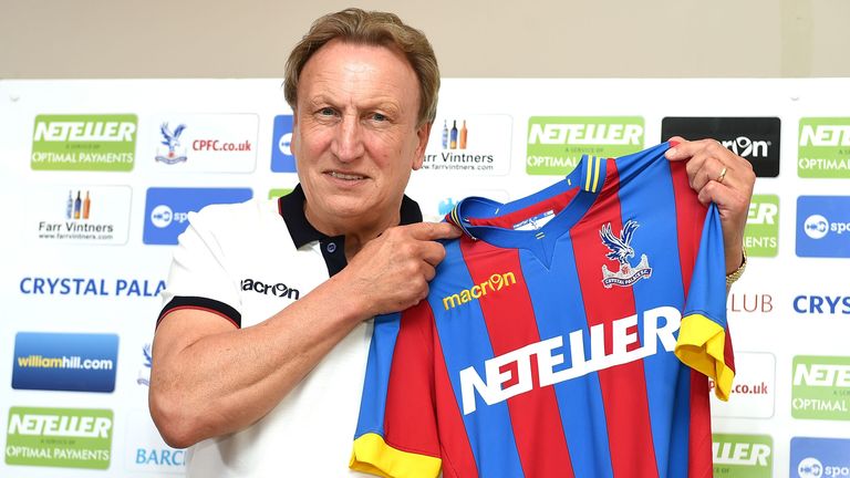 Newly appointed manager of Crystal Palace Neil Warnock poses for photographs during a press conference at training ground in Beckenham