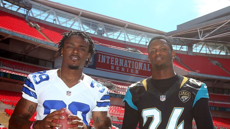 Brandon Carr of Dallas Cowboys with  Will Blackmon of Jacksonville Jaguars